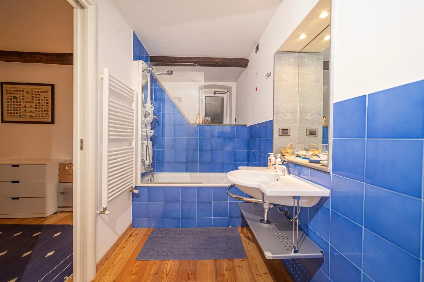 Second bathroom with blue tiles