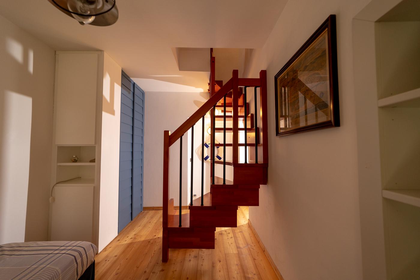 Lower bedroom and spiral staircase